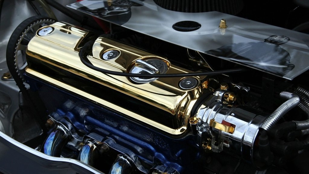 Close-up of a clean engine with a polished valve cover in an engine bay