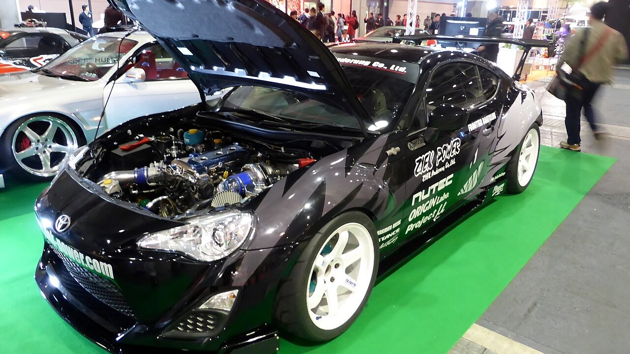 Toyota 86 with a Nissan SR20 engine swap displayed at Osaka Auto Messe 2014