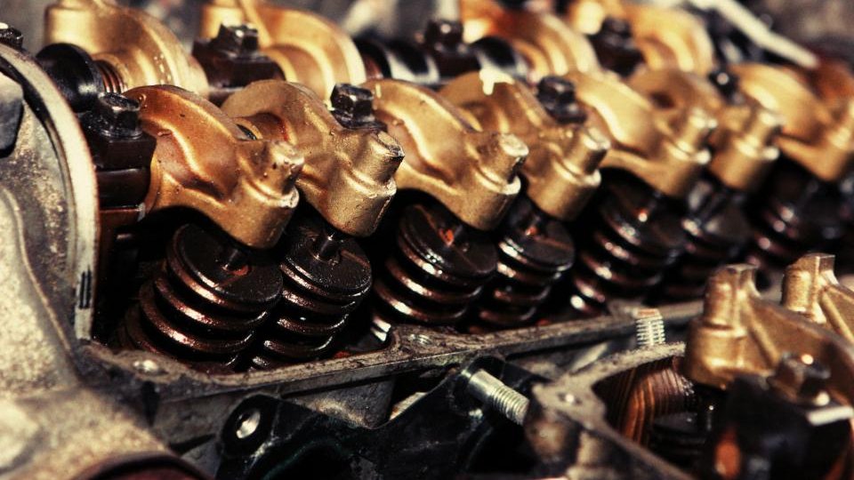 Close-up of rocker arms and valve springs on a worn engine